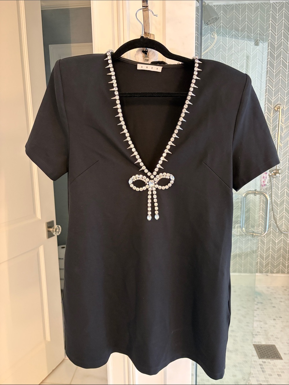 Area Black V-Neck Dress with Crystal Bow Detail and pockets. Size XS